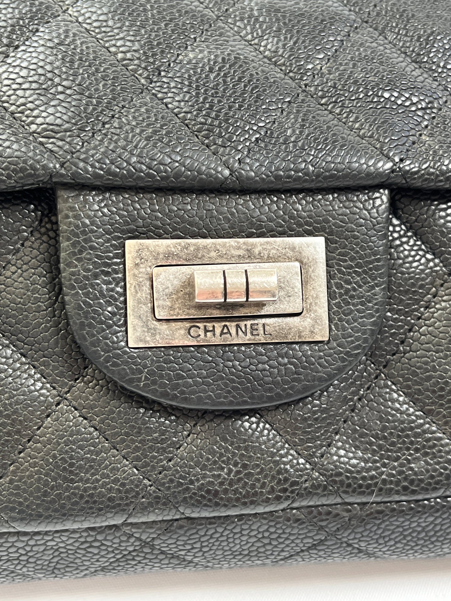 CHANEL - REISSUE EAST WEST FLAP BAG IN CAVIAR LEATHER