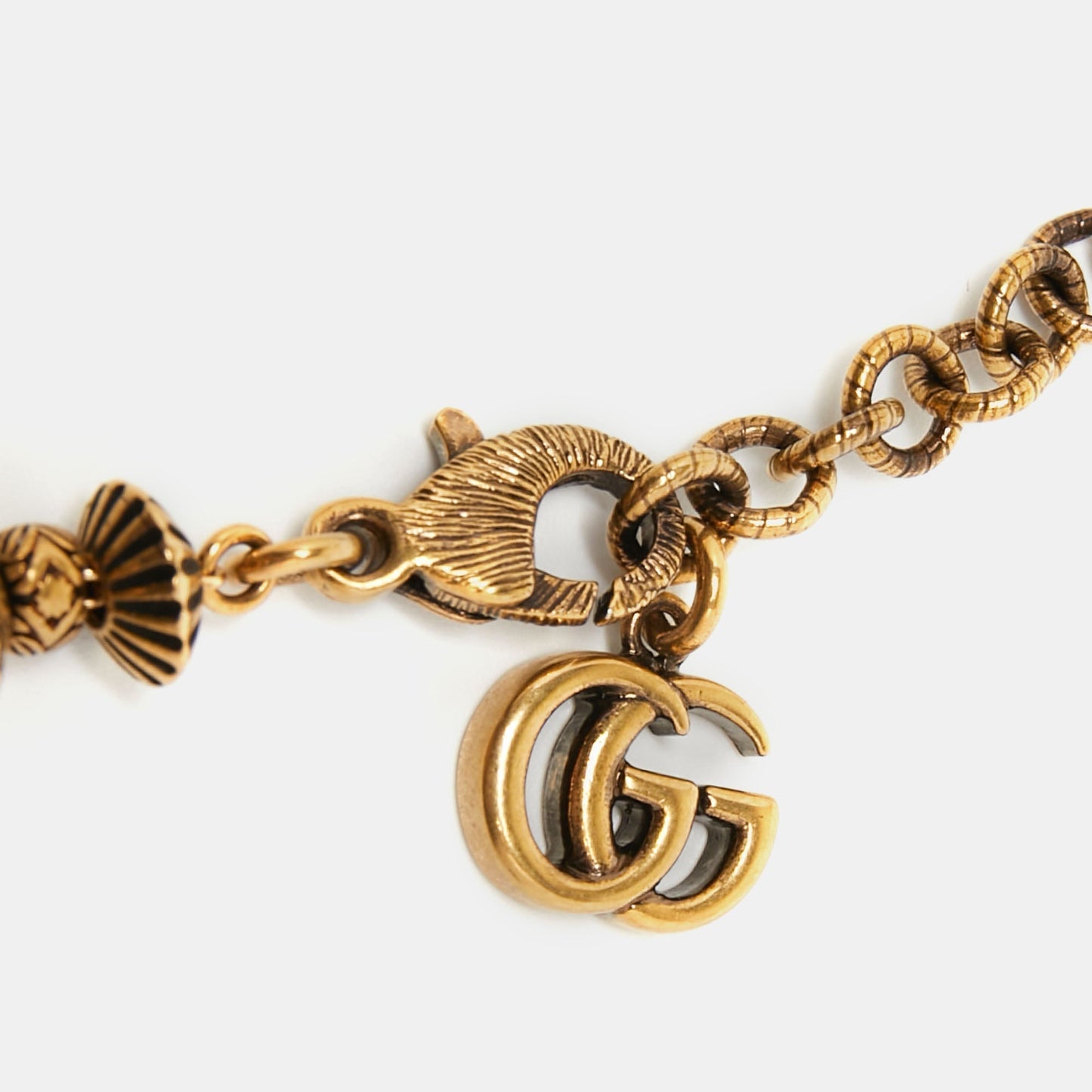 Gucci Aged Gold Tone Scarab and Cross Charms Necklace