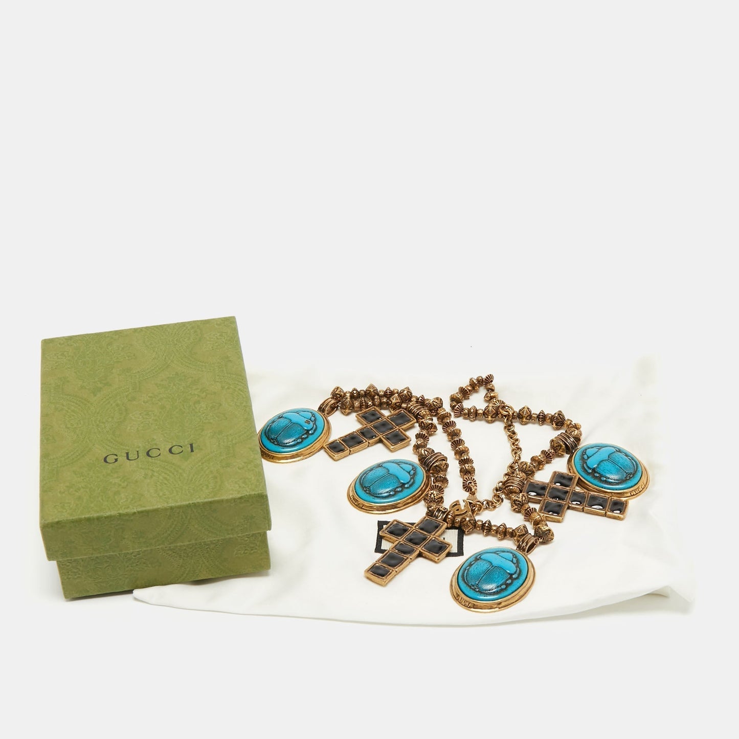 Gucci Aged Gold Tone Scarab and Cross Charms Necklace
