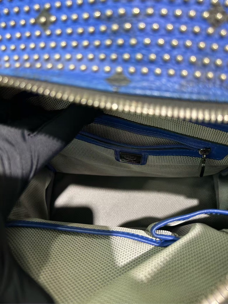 Pre-loved MCM Stark Studded Blue Leather Backpack