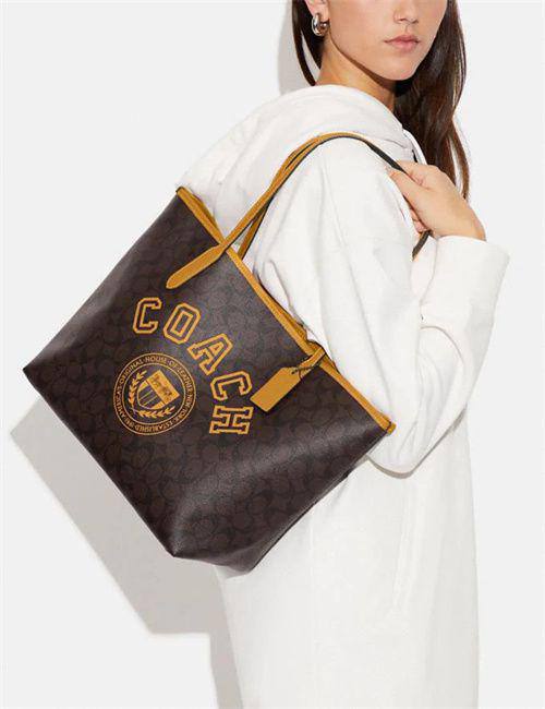 Coach City Tote In Signature Canvas With Varsity Motif In Yellow
