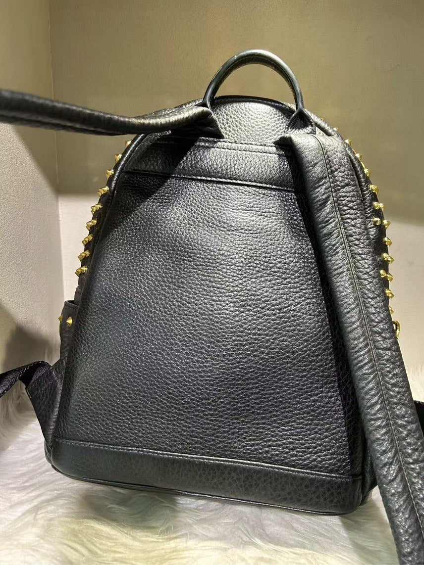 Pre-loved MCM Stark Black Backpack with Gold Studs