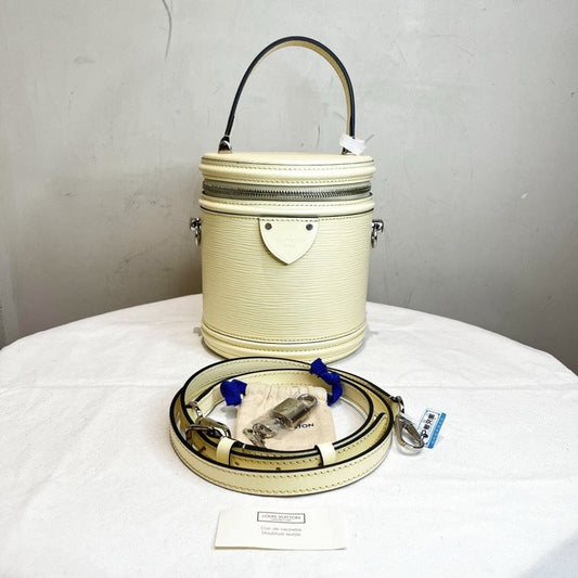 Louis Vuitton LV Epi Bucket Bag with Strap Lock and Key in Ivory Leather